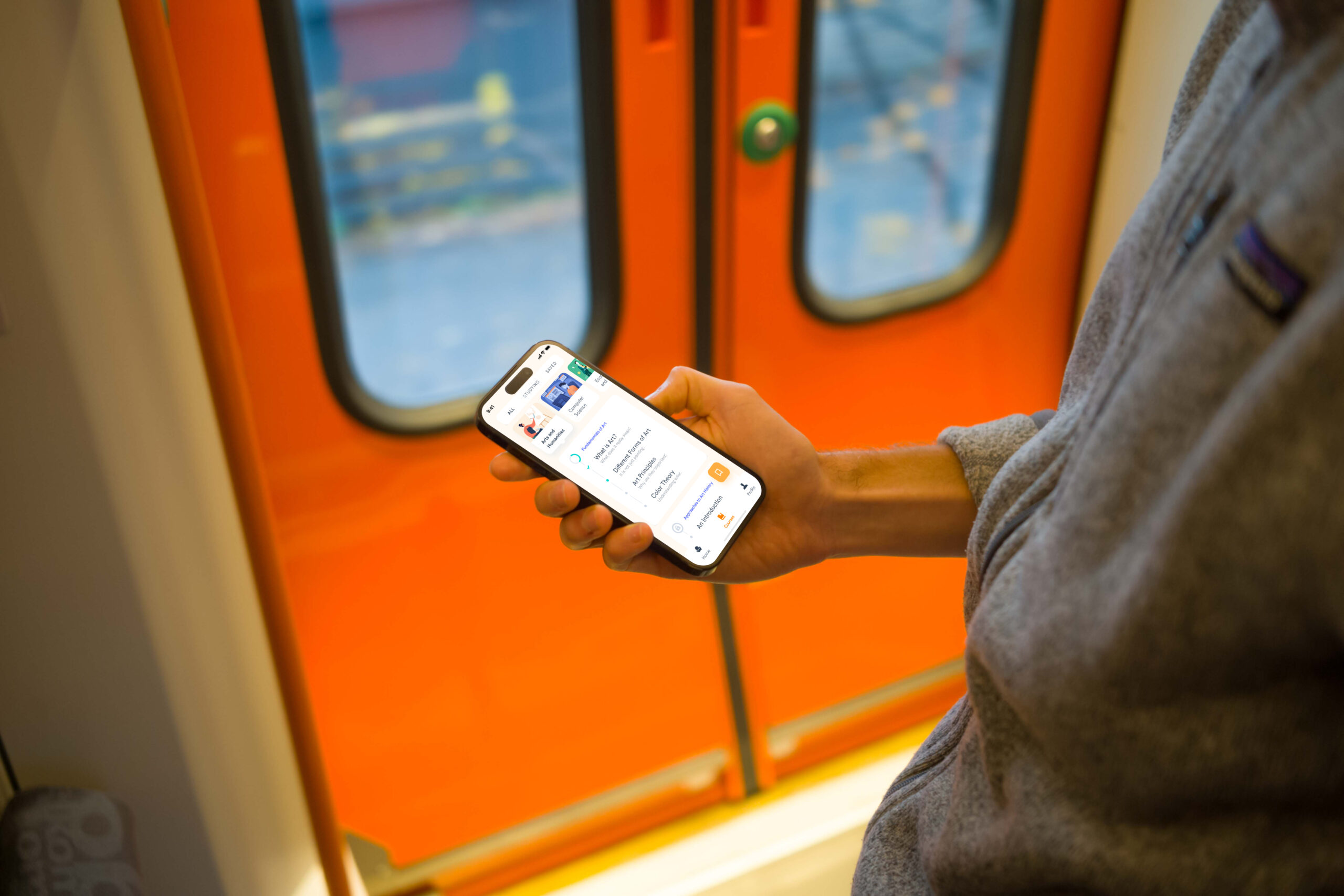 mockuuups-man-holding-smartphone-on-the-train